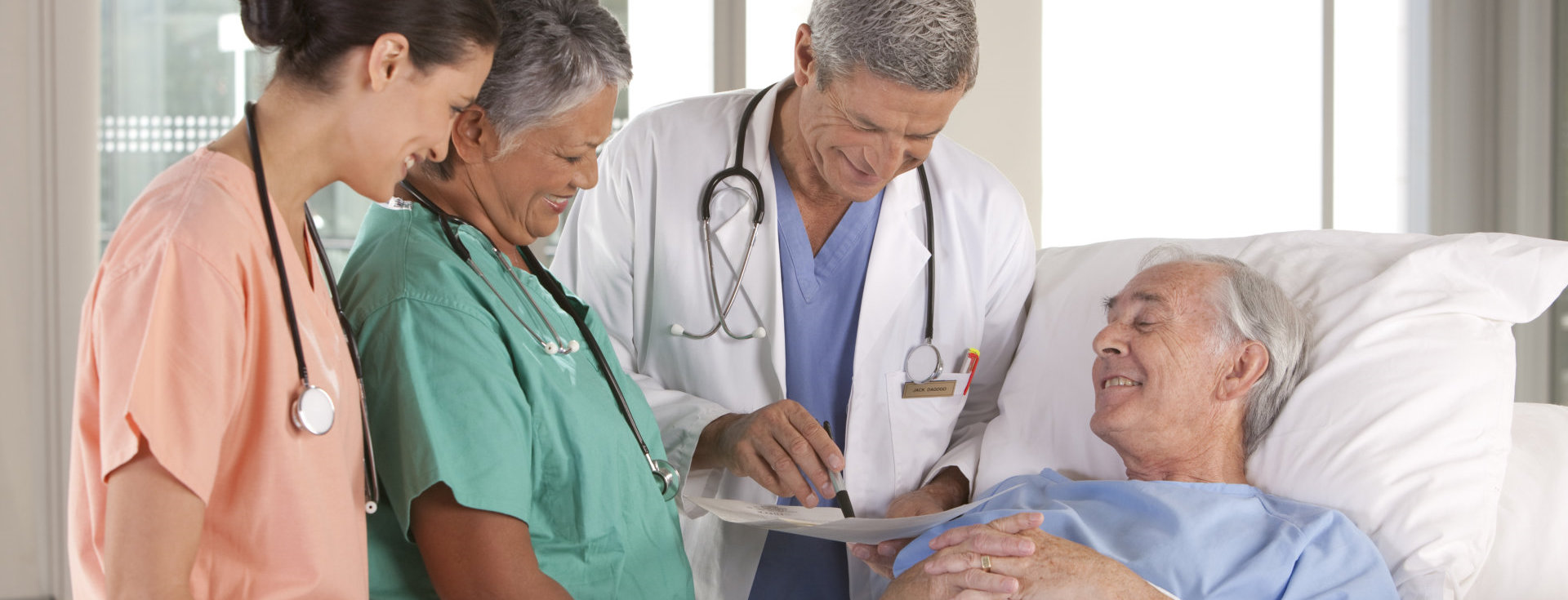 doctors taking care of old man