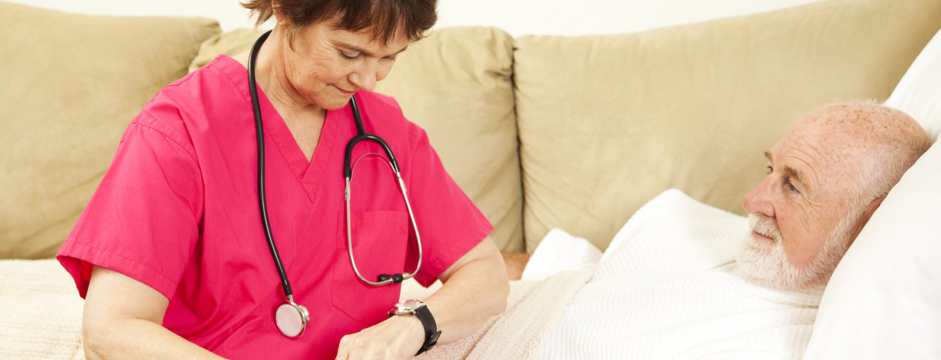 nurse taking care of old man